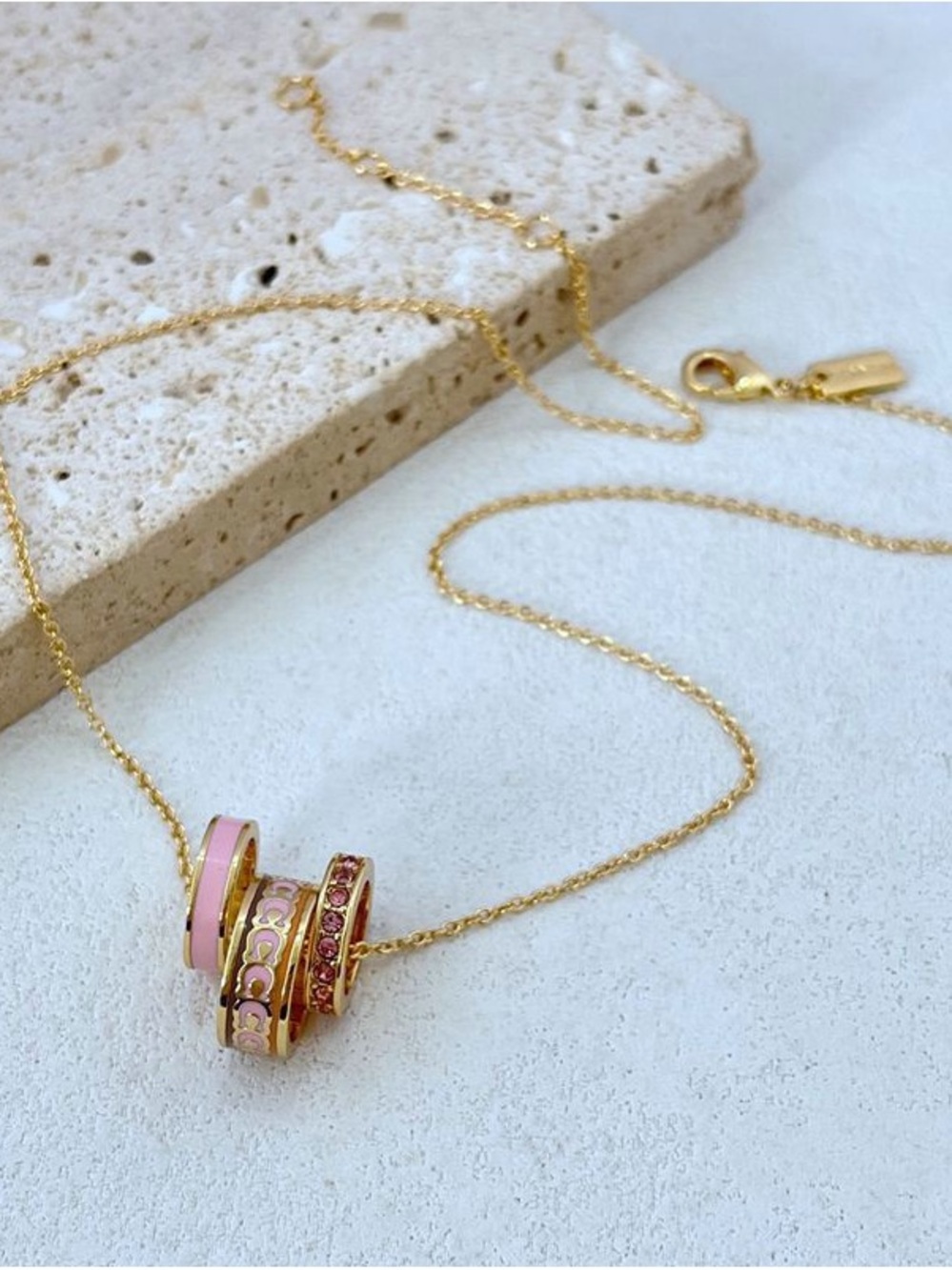 Coach Gold-Tone Necklace with Pink Enamel and Pink Crystal Rings